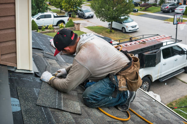 Professional Roofing technician working in Norwood, MA